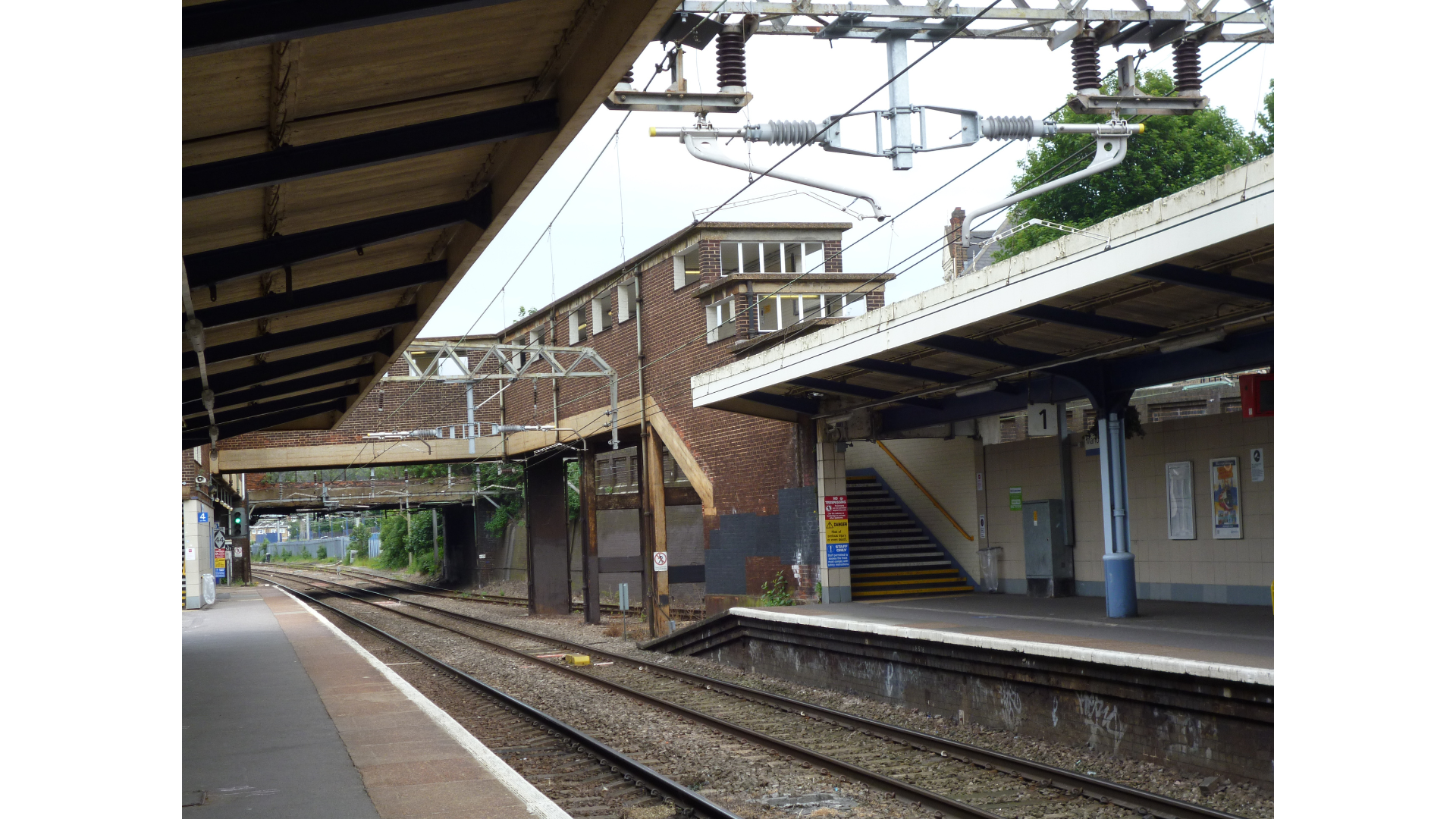 TfA supports the call for full tactile paving installation across the rail network. Next to a photo of a train station where the platform does not have tactile signage at the edge.