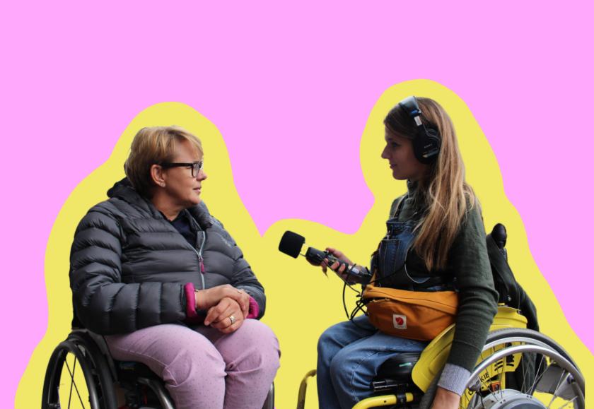 Two white women using wheelchairs facing each other. One of them is wearing headphones and holding a microphone towards the other. The background is a coloured graphic.