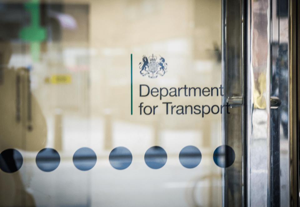 Glass door displaying the Department for Transport logo.